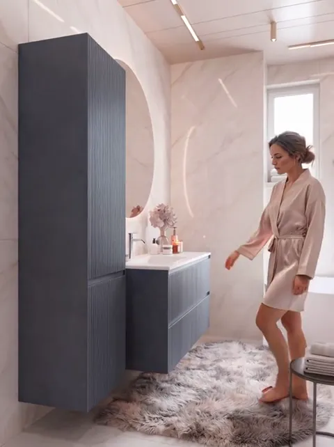 Another bathroom from the same range: dark grey fronts, a tall unit, the same basin type. The line shown in two finishes