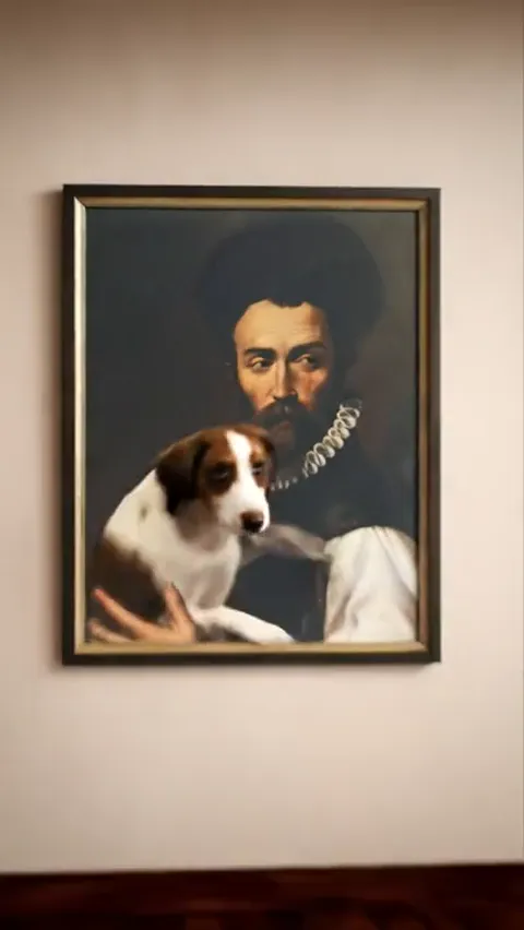 A painting in a gilt frame hangs on a wall: a portrait of a man in a Renaissance ruff holding a dog. The room is empty.
