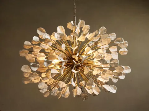The finale: the sphere entire, the wall behind it warmer. Ten seconds have shown the chandelier both as a light source a