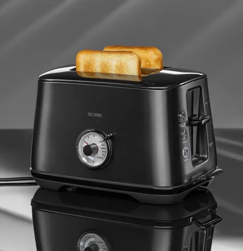 The finale: the toast up, the browning scale in focus. Five seconds have shown the appliance working and the height of t