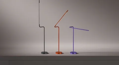 The stems unfold: each lamp swings its arm a different way at a different angle. The construction is articulated and doe