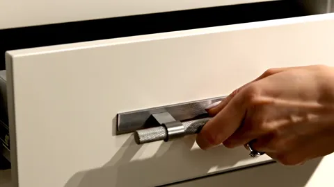 The drawer comes out. The travel is smooth and the front stays square — the soft-close is working and nothing binds.