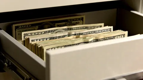The finale: the drawer open, bundles of banknotes inside. An absurd ending has made a clip about hardware one that gets 