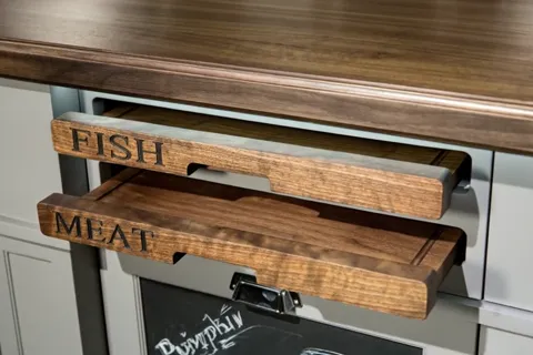 The boards are nearly fully extended, revealing a drawer with a chalkboard surface and a chalk drawing beneath. The purp