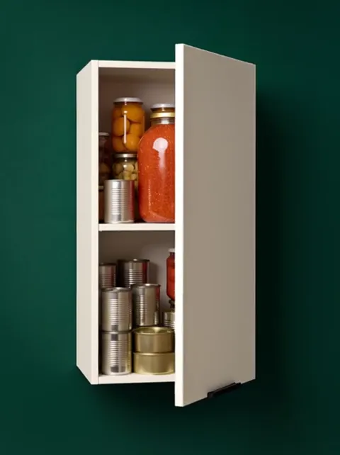 The door opens: two shelves of preserves and tins inside. The front opens through a full angle and does not obstruct acc