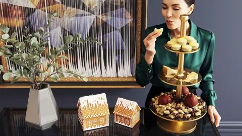 She eats, the frame closer. The central column reads: a slim brass rod with shaped spacers between the tiers.