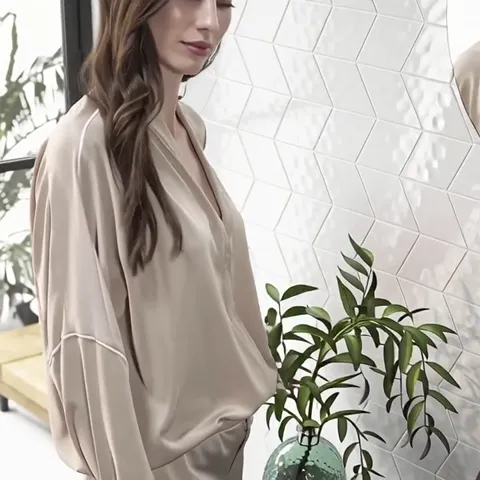 The finale: the woman in full, the relief wall behind her. Under diffuse light the relief all but disappears — it lives 