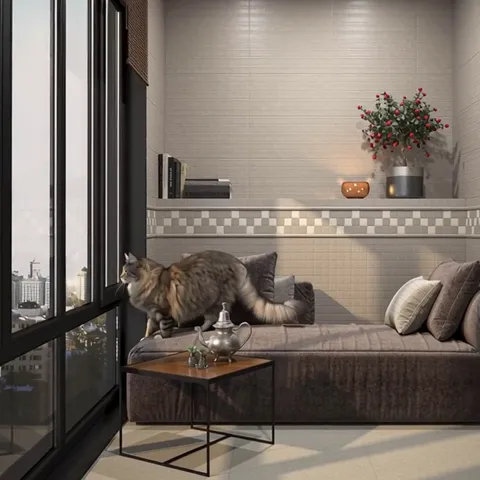 The cat moves on, sunlight falling across the wall in slanted bars from the window frames. The pale tile does not flare 