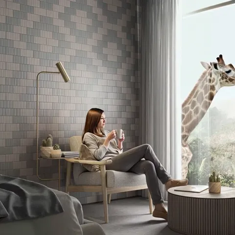 The finale: the woman seated with her legs crossed, the giraffe behind the glass. Ten seconds have held the viewer for t