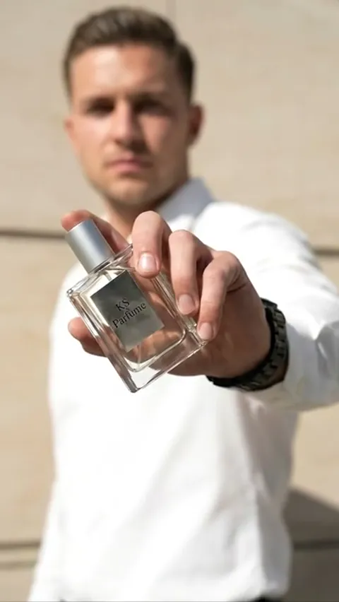 The finale: he looks at the camera, the bottle held forward. Six seconds have given both the object and the person it is