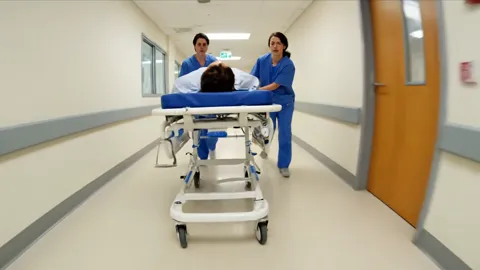 The finale: the trolley recedes down the corridor, seen from behind. Eight seconds have shown the equipment at work — th