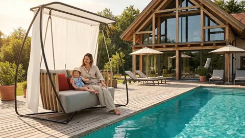 The swing moves forward. The frame stands on arched supports and does not lift off the decking — the structure is stable
