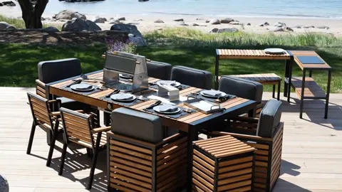 From the end: the length of the table against the row of chairs reads — six of them, with room between.