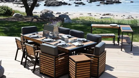 The finale: the table entire, the shore and rocks behind. Eight seconds have shown large outdoor furniture in the open a