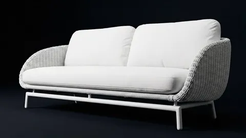 The finale: against the dark ground the sofa reads whole, the white cushions glowing. Eight seconds have shown one objec