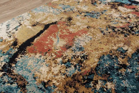 The camera shifts and light runs through the pile. The turquoise deepens, the ochre lightens — the abstraction changes i