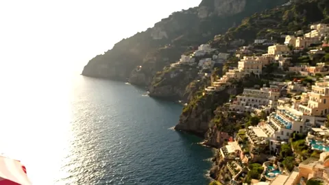 The finale: the coast entire, sun on the water. Eight seconds have shown neither furniture nor a hotel but the view peop