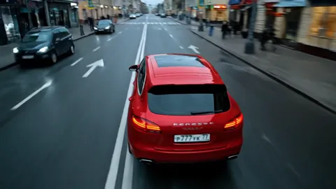 From behind: the tail, the lights, the stance on the road. The track width shows this is a crossover rather than a saloo