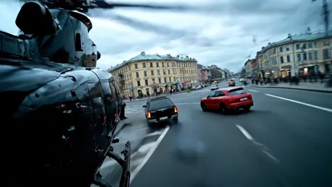 A chase along an avenue: the camera runs low behind a red crossover, black SUVs around it. Rain, spray off the wheels.