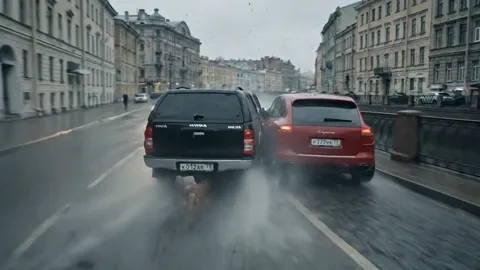 The finale: two SUVs side by side, the camera between them. Nine seconds have assembled a scene that in live production 