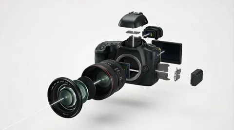 A DSLR exploded into parts, hanging in the air against white: body, lens, articulated screen, battery, mount cap.