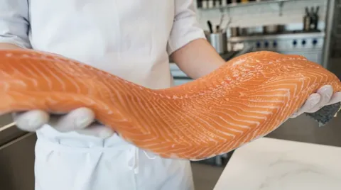 The finale: the fillet entire in the chef's hands. Five seconds have shown freshness through spring and the pattern of t
