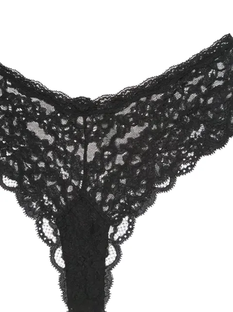 The angle changes and the piece turns. The lace runs as one panel, with no inserts of other fabric at the sides.