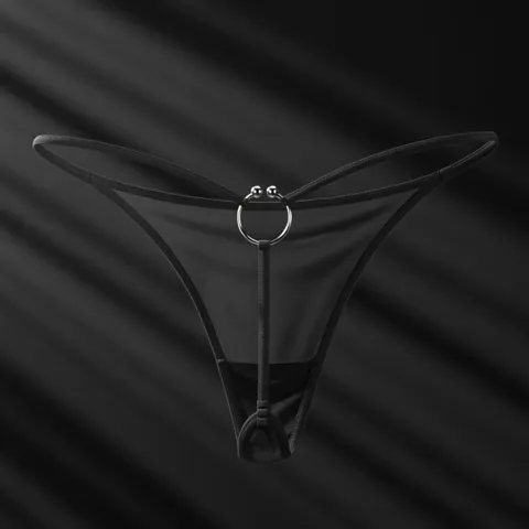 The finale against near-black: light streaks behind, the mesh lit through from behind. A delicate product shown without 