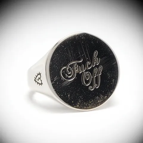 The light changes and the face goes dark. Polishing marks and fine scratches emerge — the metal is real rather than rend