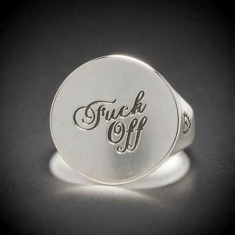 The finale: the ring in a narrow pool of light, the band in shadow. Ten seconds have shown silver under four lightings —