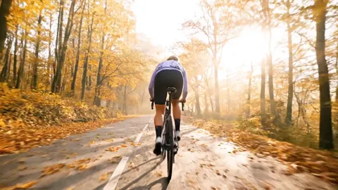 The finale: the figure small in the perspective of the road, sun in mist. Eight seconds have shown the riding position a