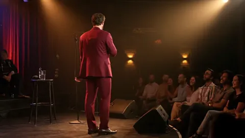 The finale: the man with his back to camera, the room in front of him. Eight seconds have shown the suit in the scenario