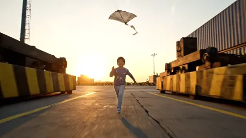 The finale: the boy runs off toward the sun, the plane in the air. Eight seconds have shown a children's garment at a ru